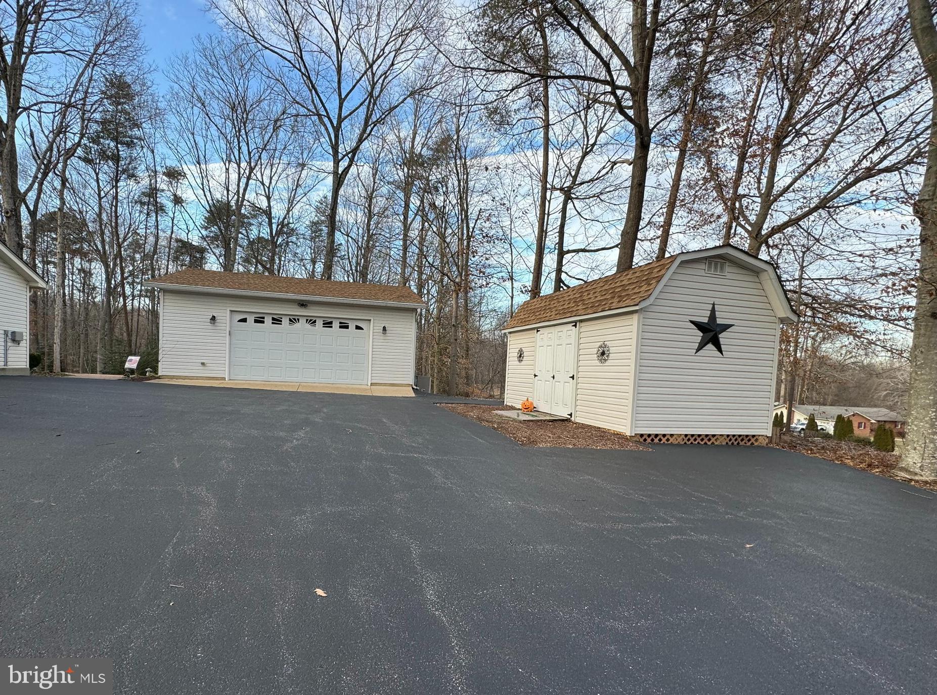 16130 Inheritance Drive Brandywine, MD 20613 - Photo 31 of 39 a view of a house with a yard and garage
