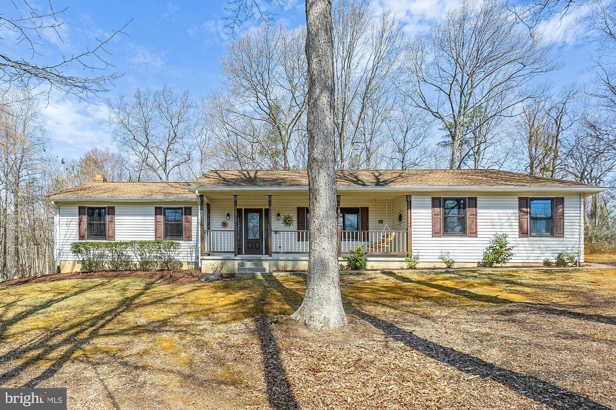 16130 Inheritance Drive Brandywine, MD 20613 - Photo 34 of 39 a front view of a house with a garden and trees