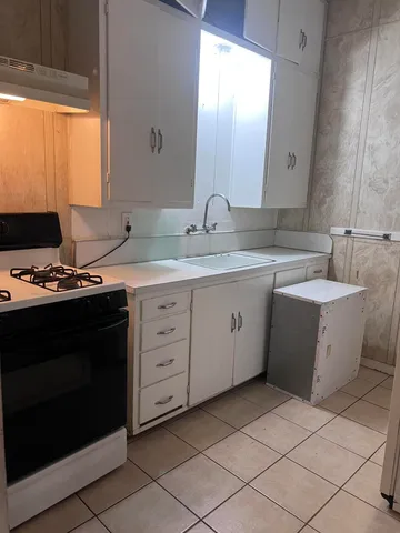 a spacious bathroom with a double vanity sink and mirror