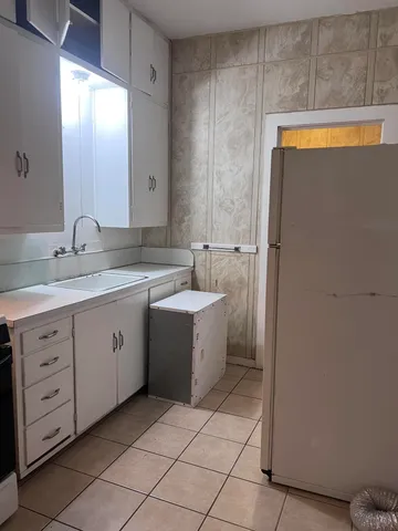 a bathroom with a toilet a sink and a mirror