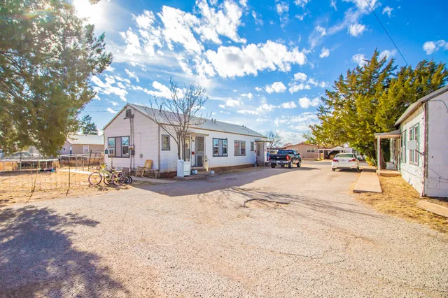 a view of road with card and car parked