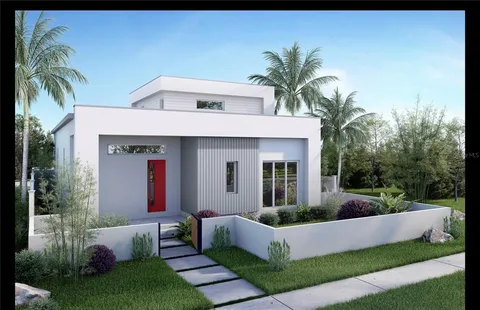 a front view of house with yard and outdoor seating