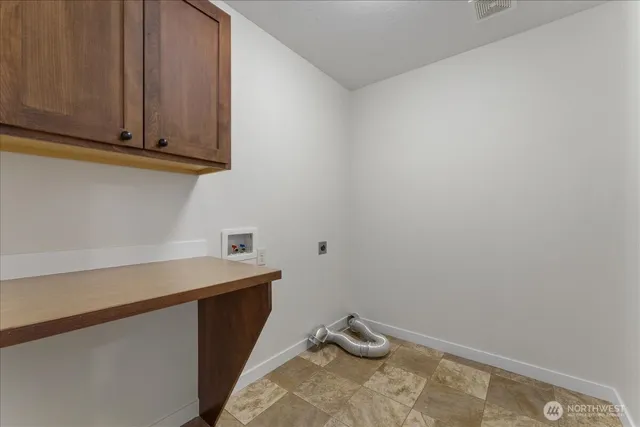 a view of a house with a yard and furniture