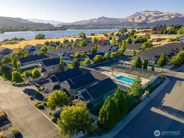 an aerial view of residential houses and outdoor space