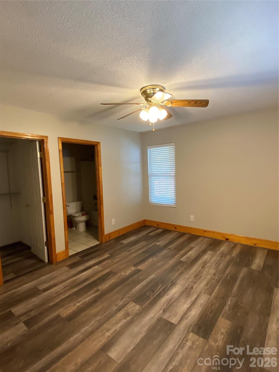 1324 Rustic Lane Northwest Concord, NC 28027 - Photo 4 of 15 a view of an empty room with window and wooden floor