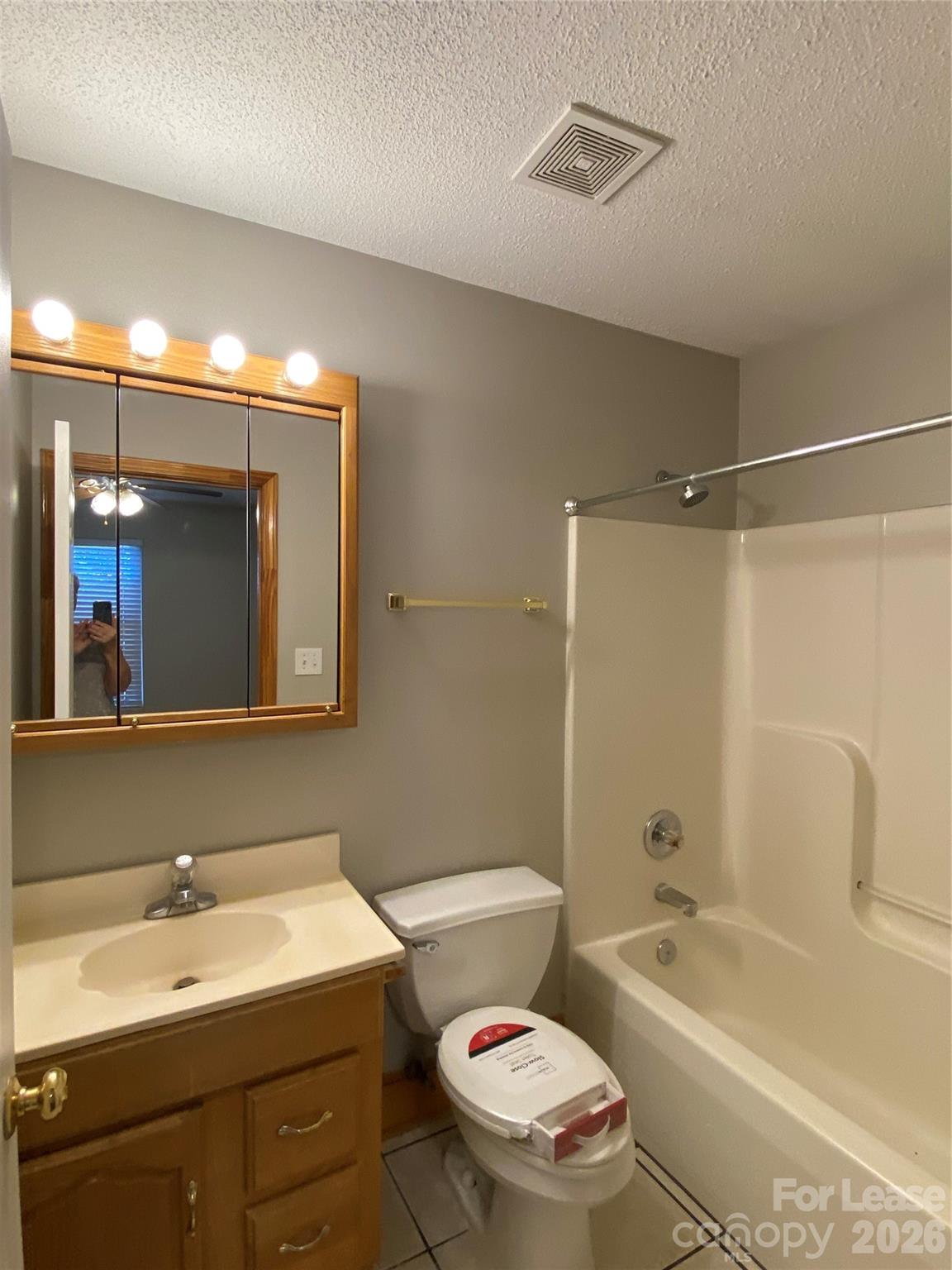 1324 Rustic Lane Northwest Concord, NC 28027 - Photo 5 of 15 a bathroom with a sink toilet vanity mirror and bathtub