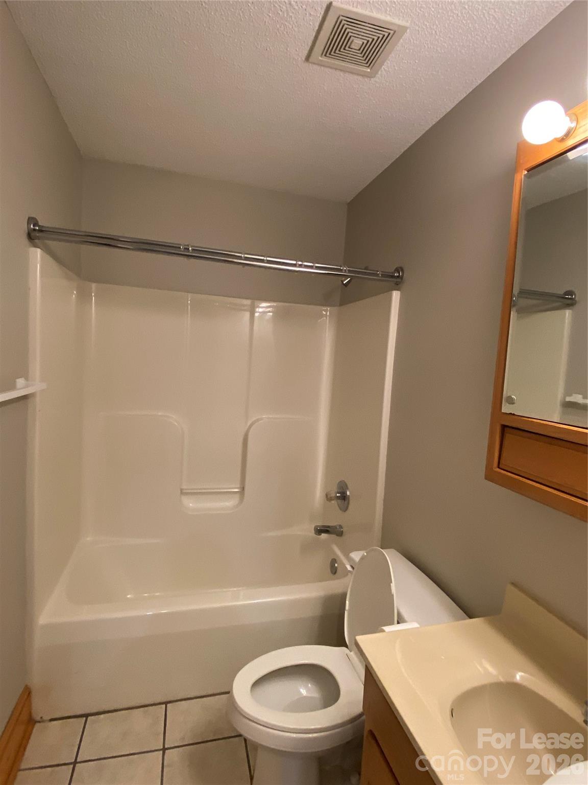 1324 Rustic Lane Northwest Concord, NC 28027 - Photo 8 of 15 a bathroom with a sink toilet and shower