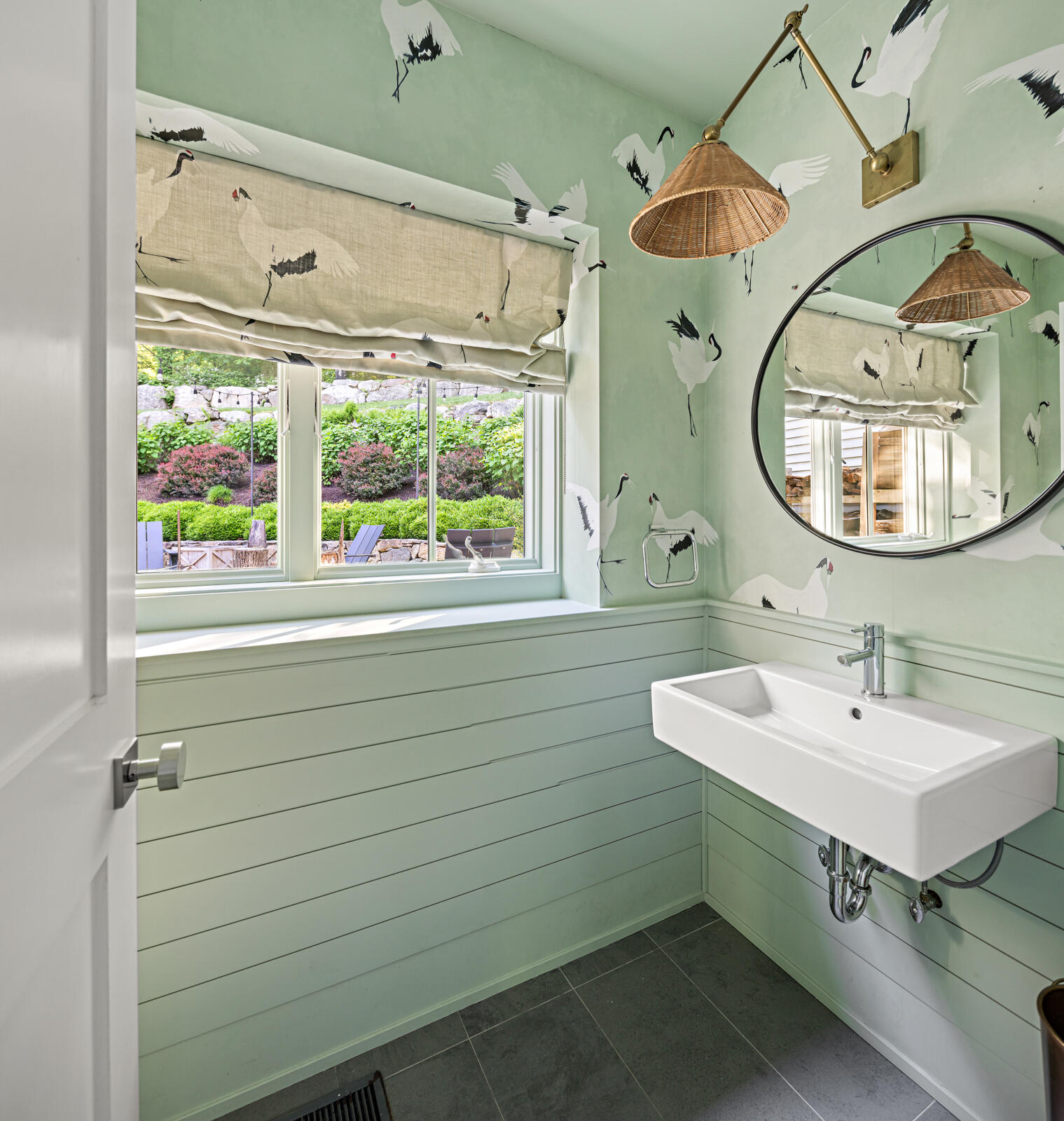 311 Mill Road New Canaan, CT 06840 - Photo 17 of 30 a bathroom with a sink a mirror a vanity and a window