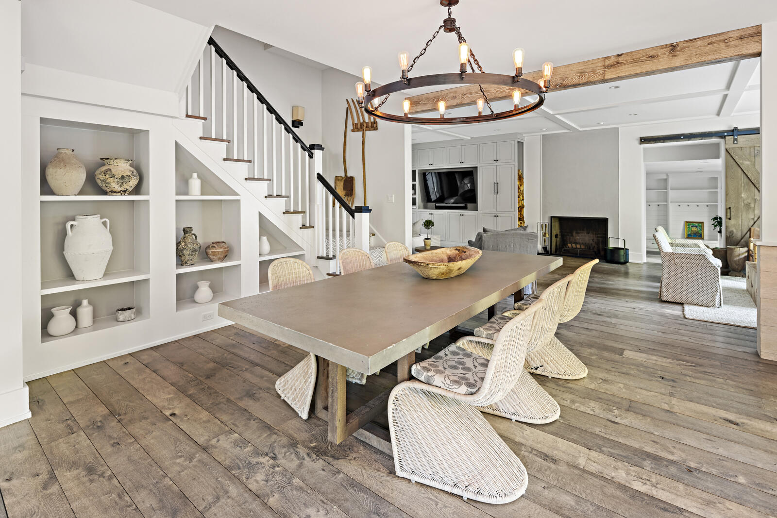 311 Mill Road New Canaan, CT 06840 - Photo 9 of 30 a view of a dining room with furniture a chandelier and wooden floor
