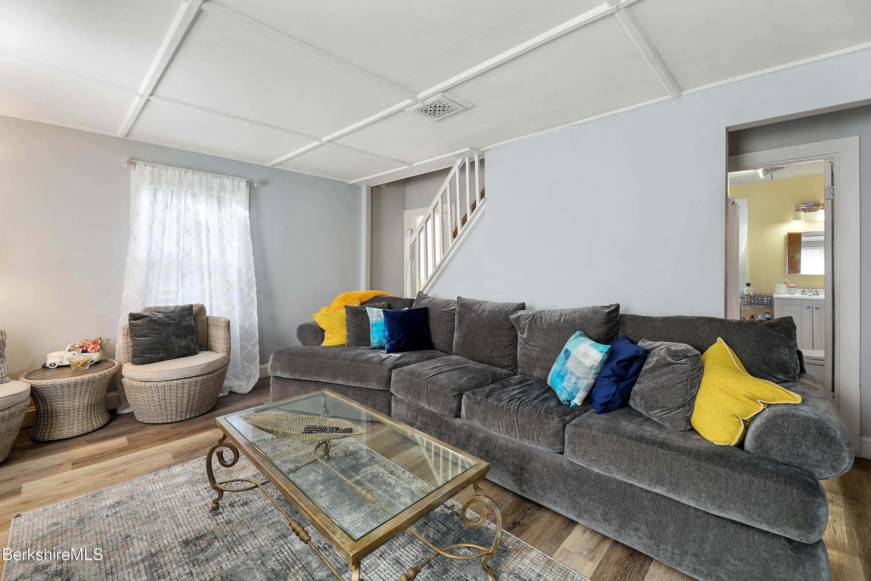 40 Summer Street Lee, MA 01238 - Photo 11 of 19 a living room with furniture and a potted plant