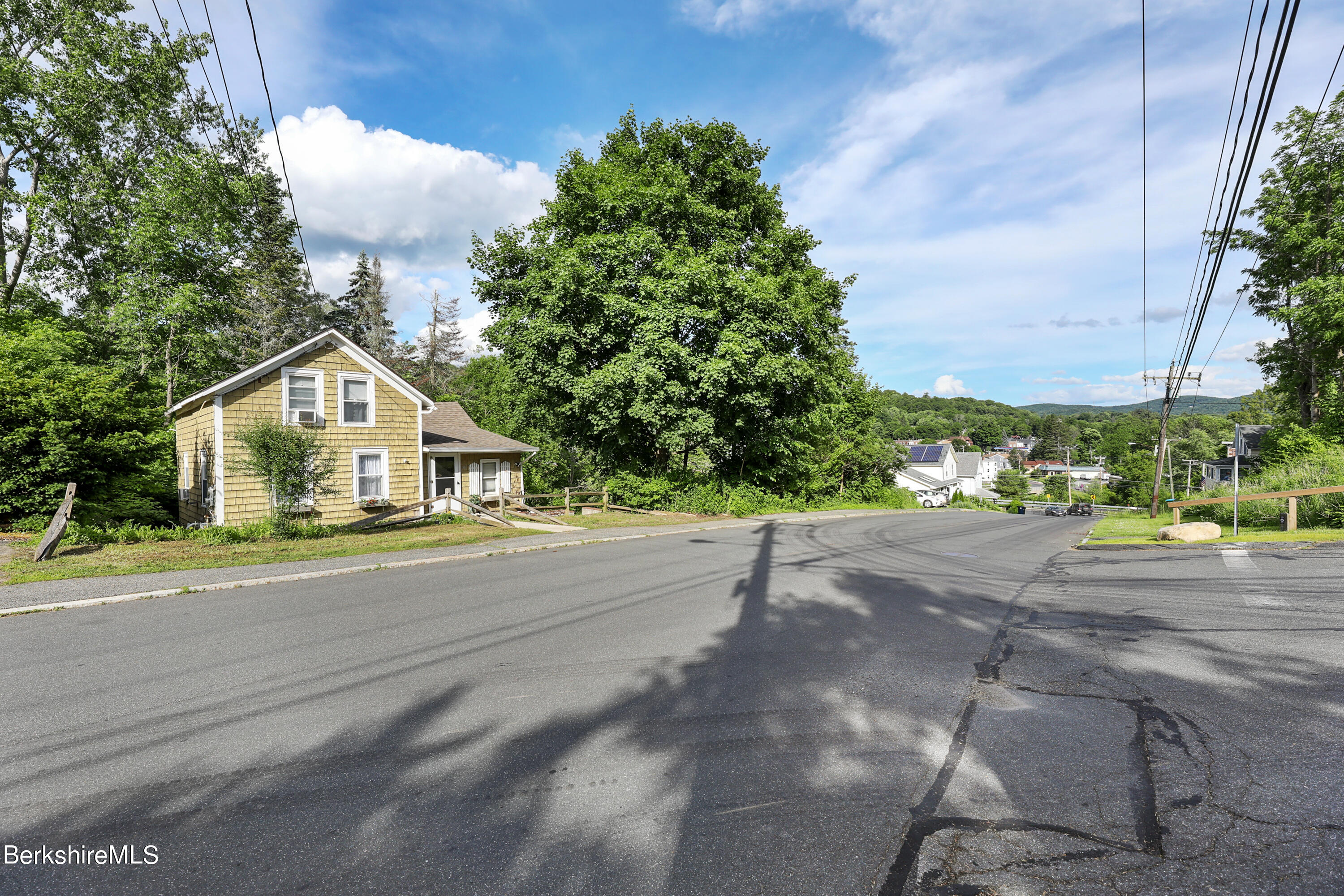 40 Summer Street Lee, MA 01238 - Photo 17 of 19 a front view of a house with a yard and garage