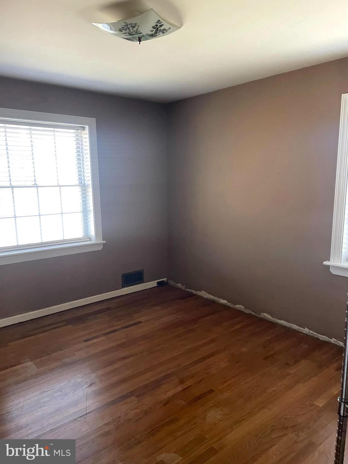 256 Line Road Kennett Square, PA 19348 - Photo 13 of 21 an empty room with wooden floor and windows