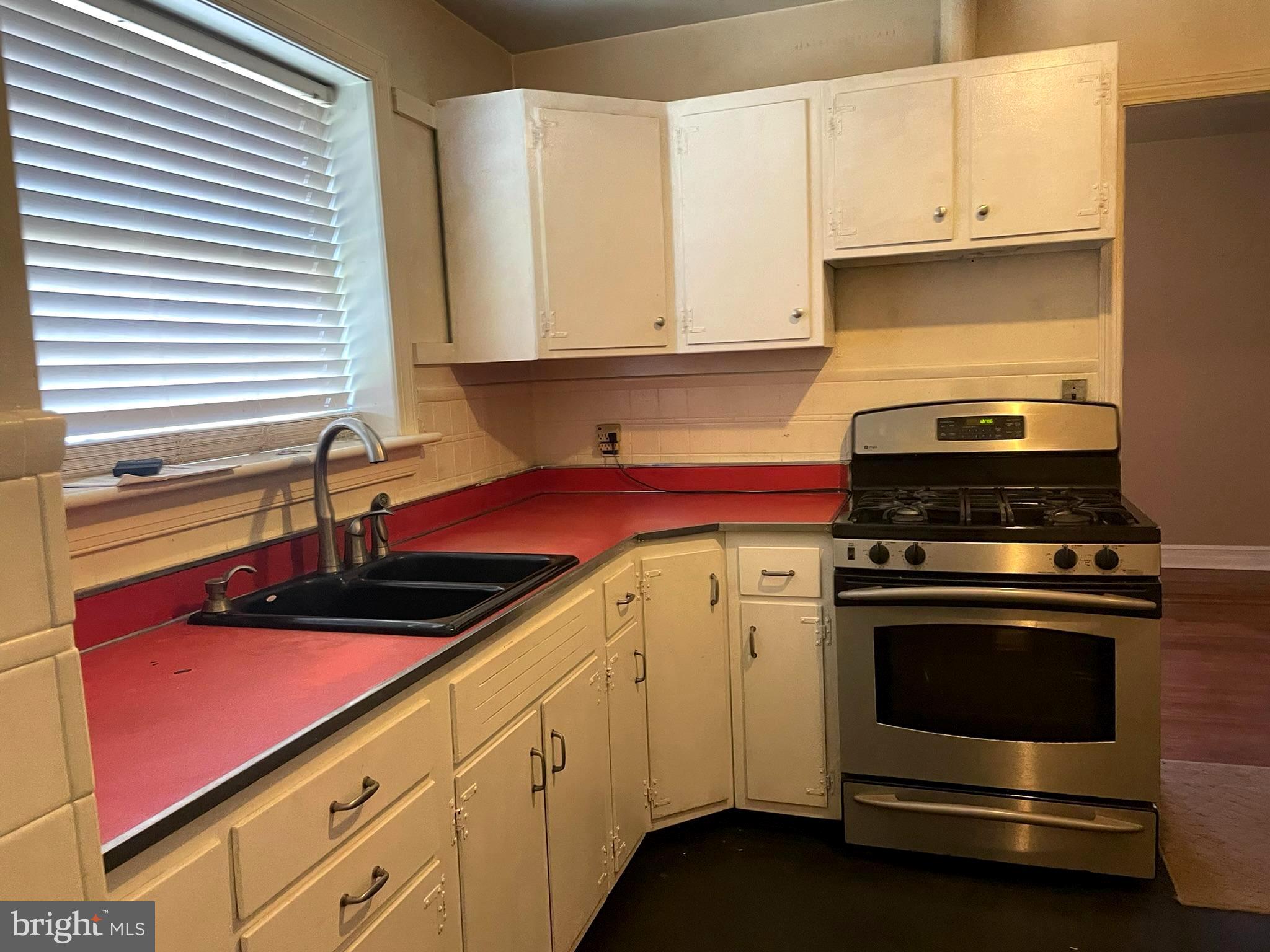 256 Line Road Kennett Square, PA 19348 - Photo 4 of 21 a kitchen with granite countertop white cabinets and stainless steel appliances