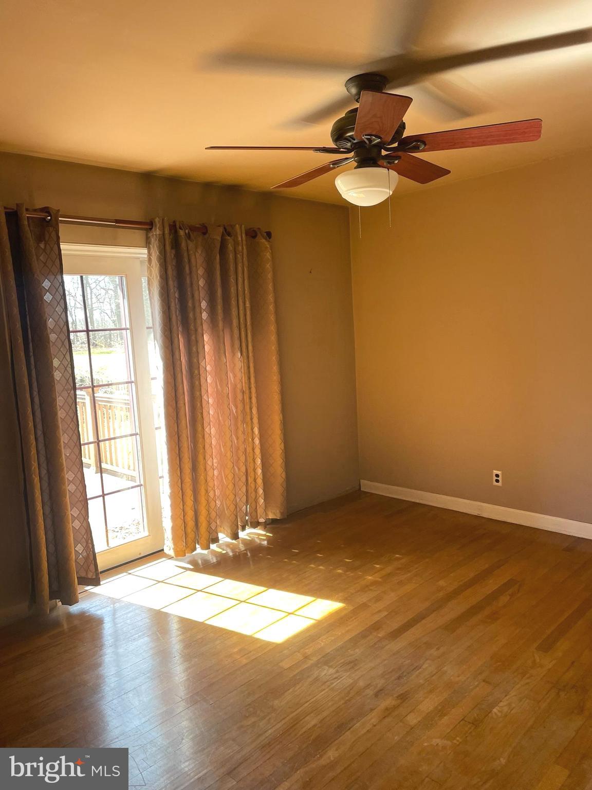 256 Line Road Kennett Square, PA 19348 - Photo 8 of 21 an empty room with wooden floor and windows