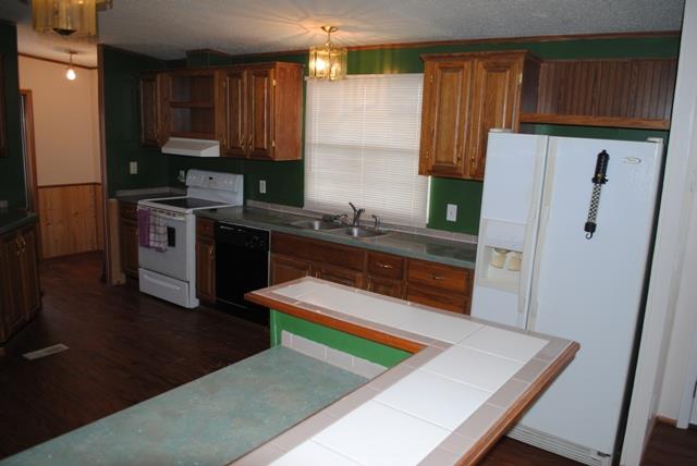 651 Cook Road Portland, TN 37148 - Photo 11 of 18 a kitchen with a refrigerator and a sink