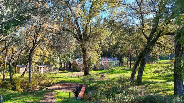 a backyard of a house with yard and green space