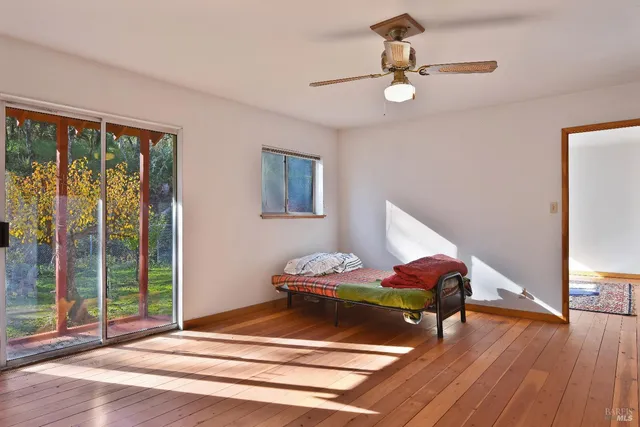 a bedroom with furniture and window