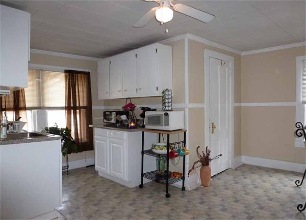 33 Greenleaf Street Springfield, MA 01108 - Photo 13 of 19 a kitchen with a refrigerator and a stove top oven