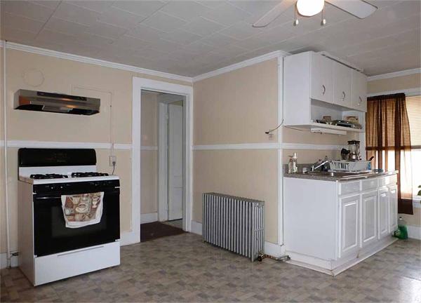 33 Greenleaf Street Springfield, MA 01108 - Photo 15 of 19 a kitchen with stainless steel appliances granite countertop a stove and a refrigerator
