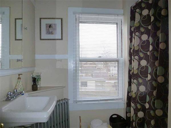 33 Greenleaf Street Springfield, MA 01108 - Photo 19 of 19 a bathroom with a sink and a mirror