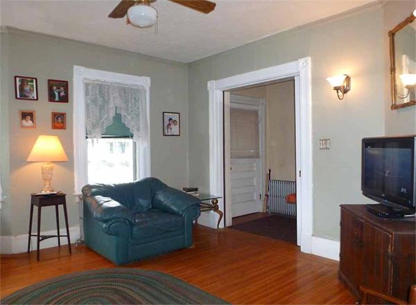 33 Greenleaf Street Springfield, MA 01108 - Photo 2 of 19 a living room with furniture and a flat screen tv