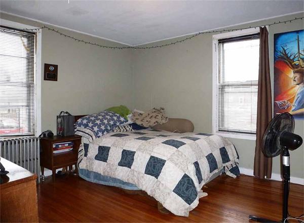 33 Greenleaf Street Springfield, MA 01108 - Photo 10 of 19 a bedroom with a bed and a window