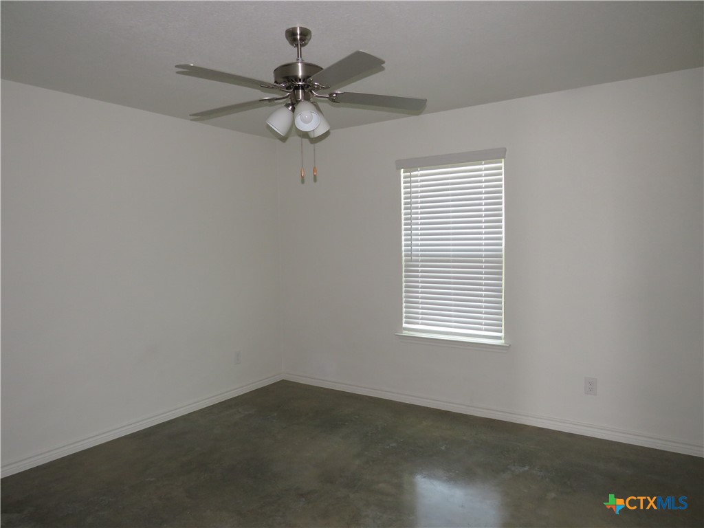 1004 Barbara Jordan Street, Unit B Killeen, TX 76543 - Photo 11 of 13 an empty room with a window and a fan