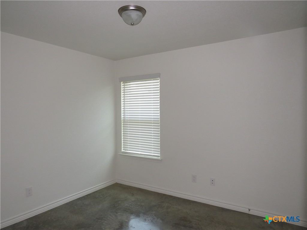 1004 Barbara Jordan Street, Unit B Killeen, TX 76543 - Photo 10 of 13 an empty room with a window