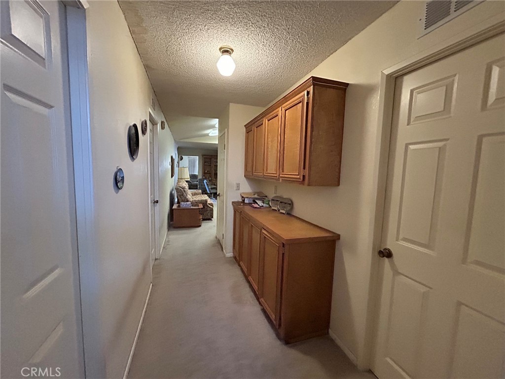 27250 Murrieta Road, Unit 347 Menifee, CA 92586 - Photo 28 of 39 a view of hallway with cabinets