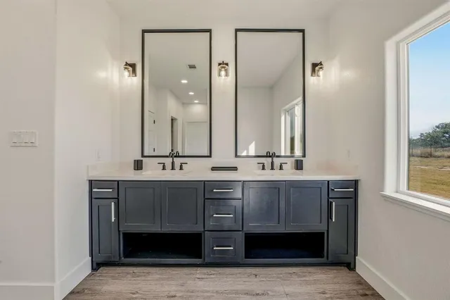 a bathroom with a sink and a mirror
