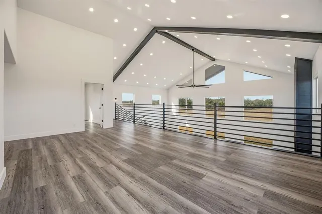 a view of a room with wooden floor and stairs