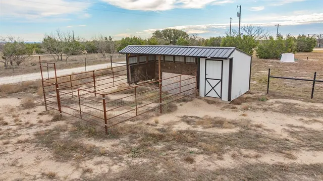 a view of a terrace with a small yard