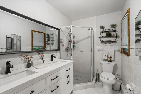 a bathroom with a sink toilet and shower