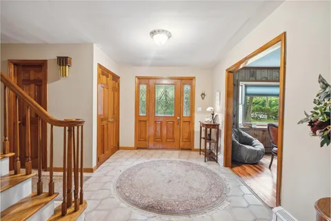 a view of a livingroom with furniture and entryway