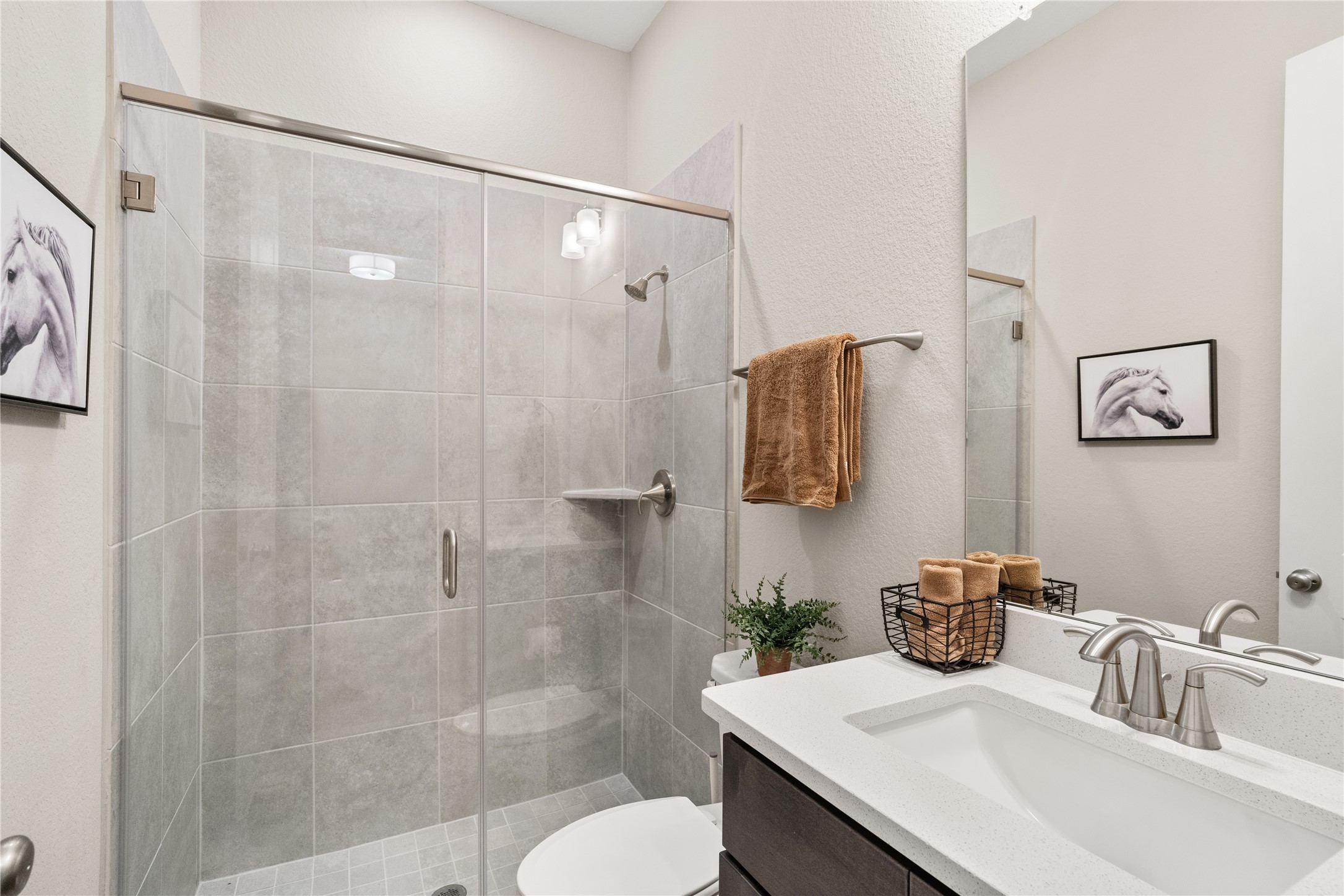 3118 Swift Way Katy, TX 77493 - Photo 27 of 34 Bathroom (Walk-In Shower) – This well-appointed bathroom includes a spacious glass-enclosed shower with modern tile surround and a sleek vanity with ample counter space.