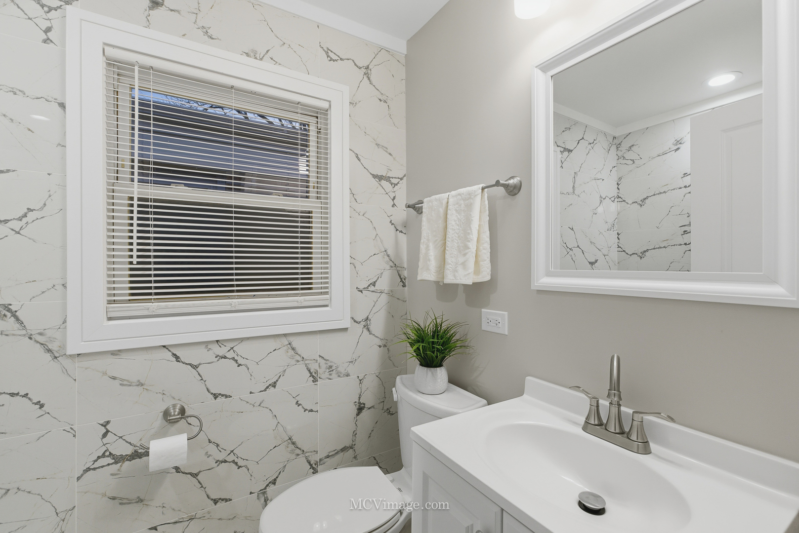 11250 South May Street Chicago, IL 60643 - Photo 11 of 22 a bathroom with a sink a toilet and a mirror