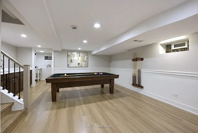 a room with wooden floor and furniture