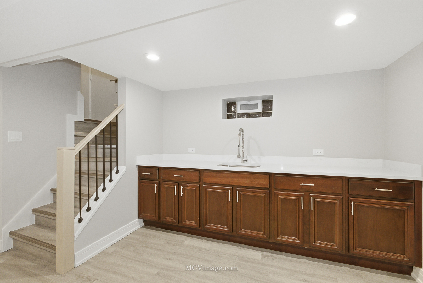 11250 South May Street Chicago, IL 60643 - Photo 17 of 22 a hallway with sink and wooden floor