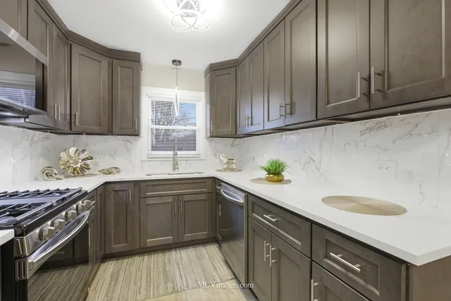 a kitchen with a sink stove and cabinets