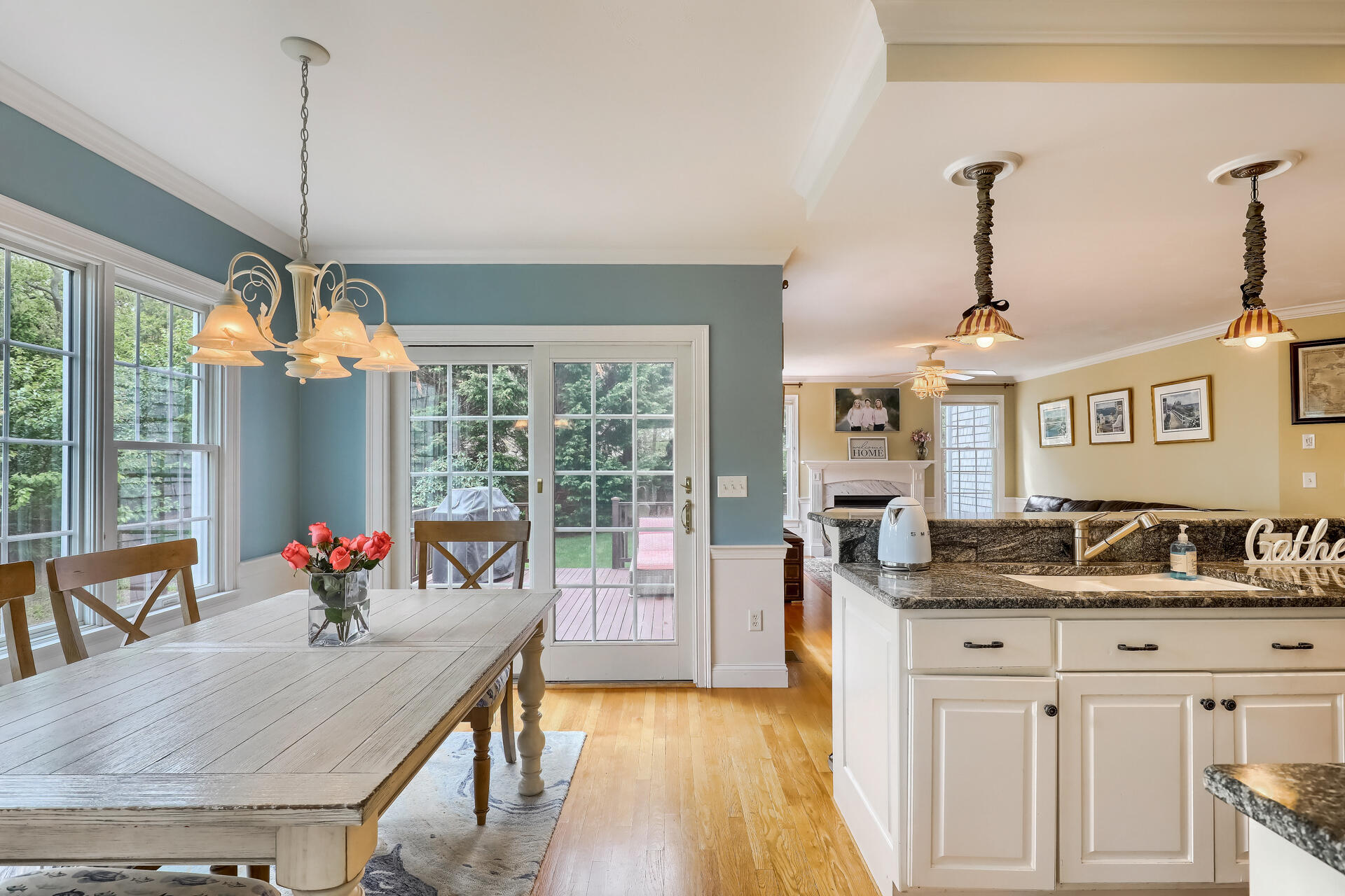 140 Great Marsh Road West Barnstable, MA 02668 - Photo 12 of 46 a outdoor kitchen with granite countertop a dining table chairs and white walls