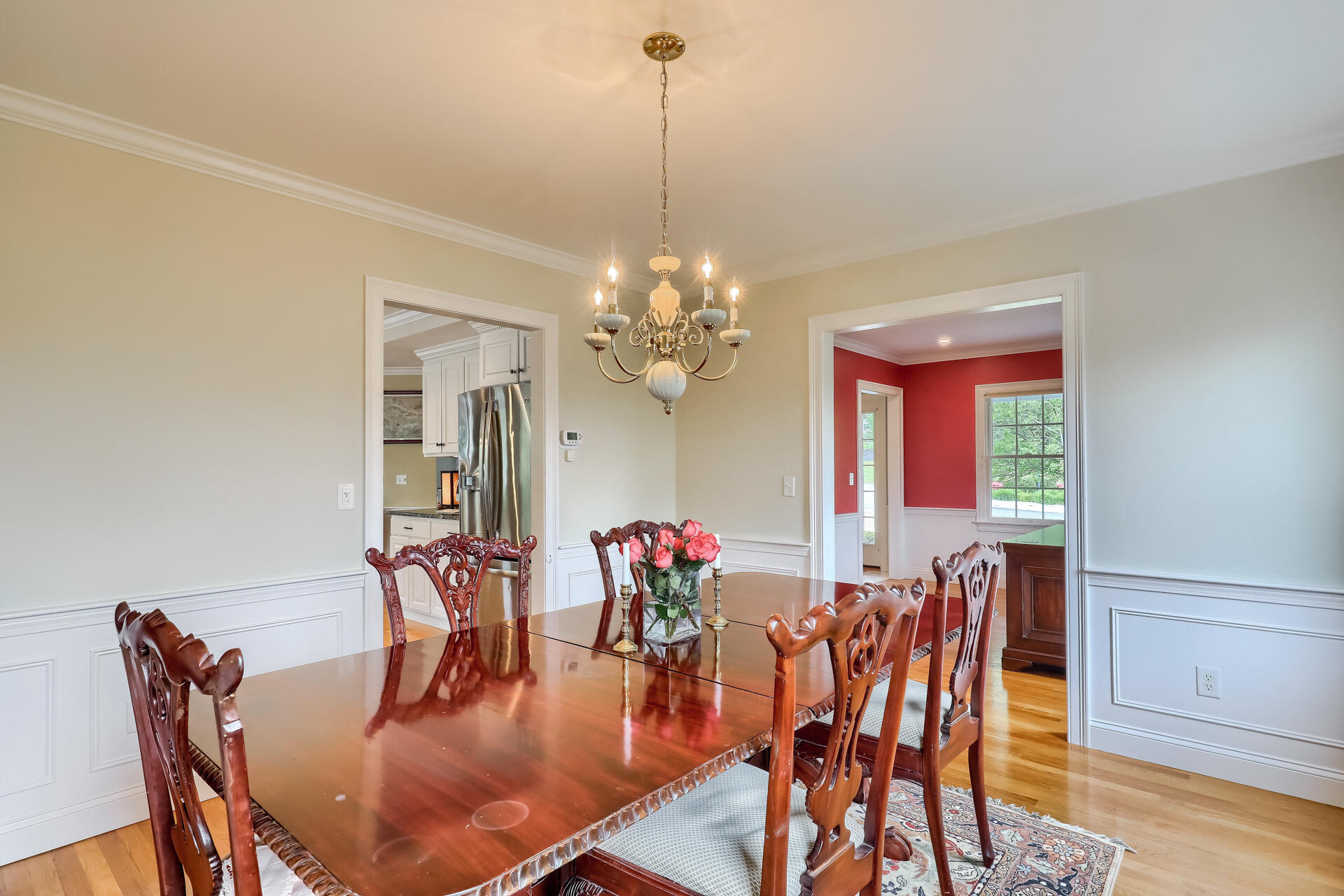 140 Great Marsh Road West Barnstable, MA 02668 - Photo 19 of 46 a dining room with furniture a chandelier and wooden floor