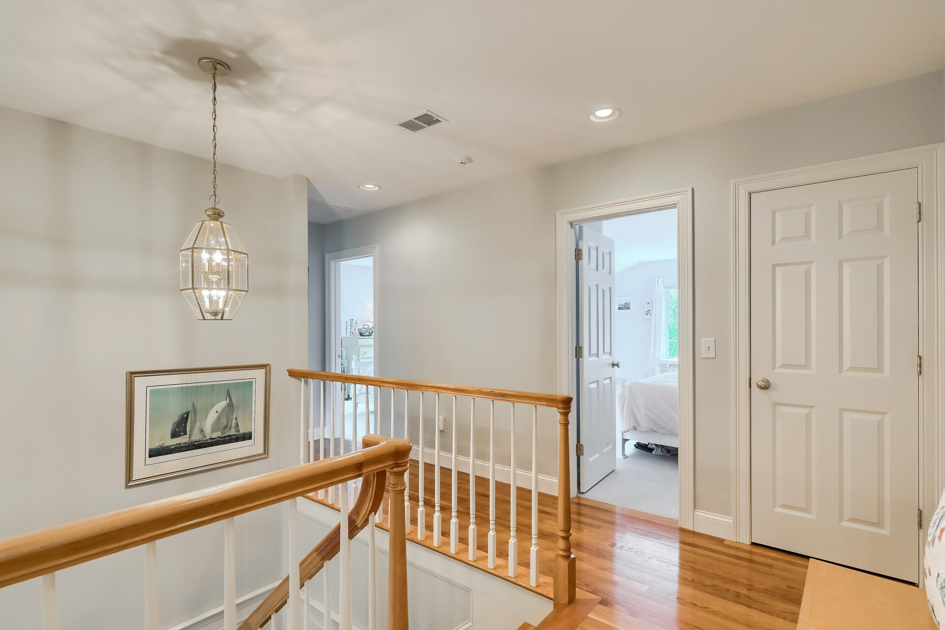 140 Great Marsh Road West Barnstable, MA 02668 - Photo 22 of 46 a view of a hallway with wooden floor and staircase