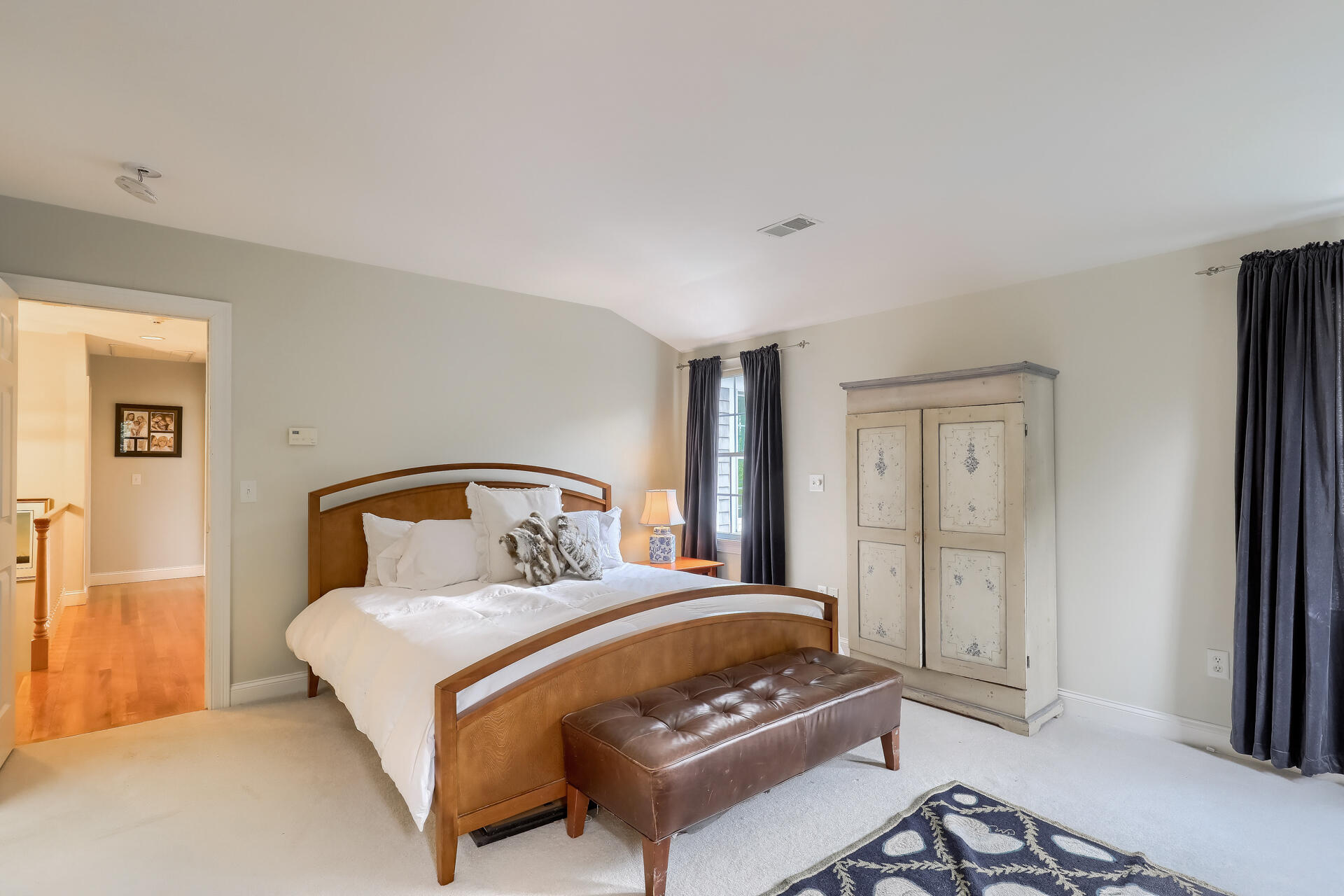 140 Great Marsh Road West Barnstable, MA 02668 - Photo 23 of 46 a bedroom with a bed and wooden floor