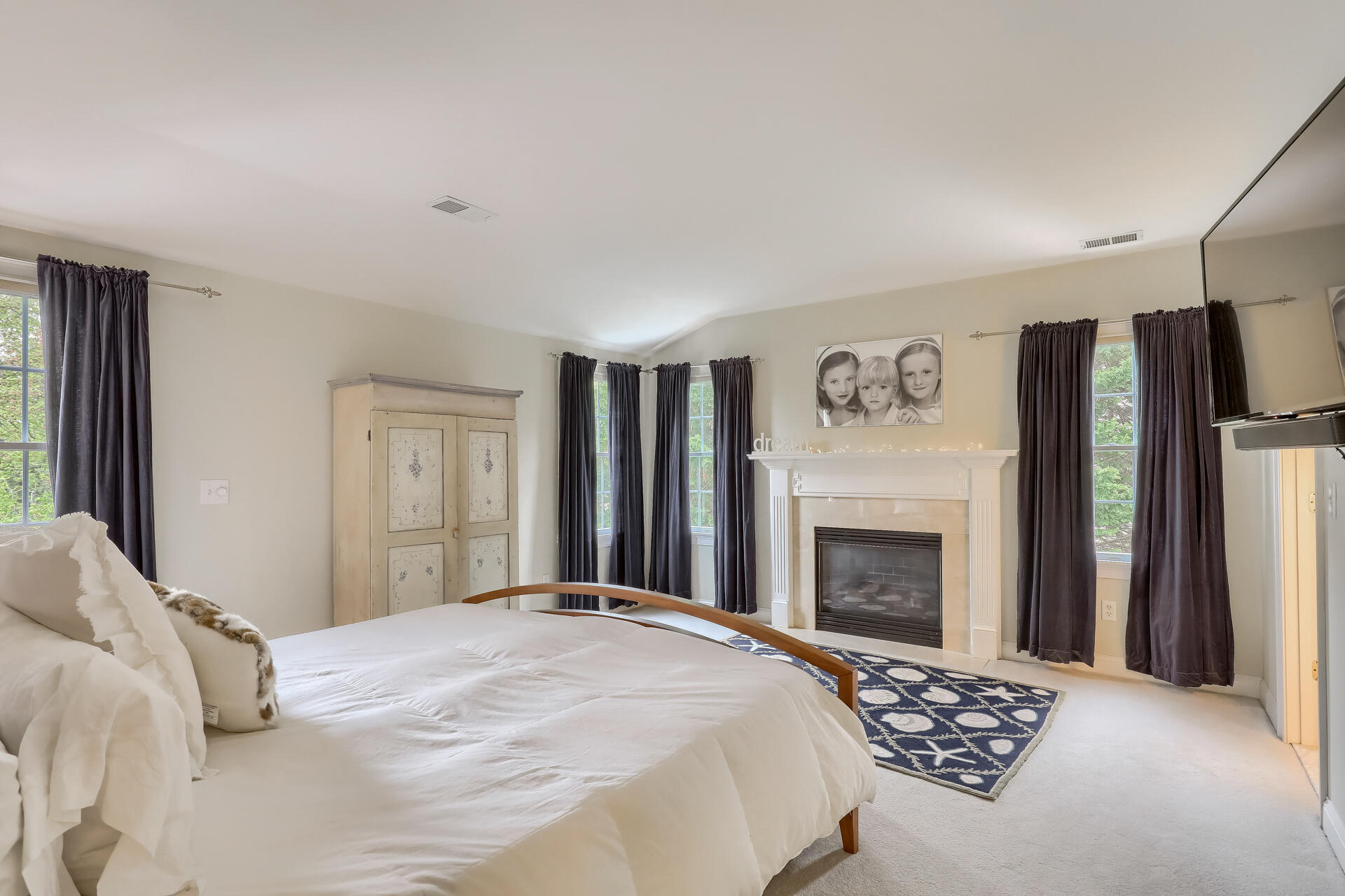 140 Great Marsh Road West Barnstable, MA 02668 - Photo 24 of 46 a bedroom with a bed and a fireplace