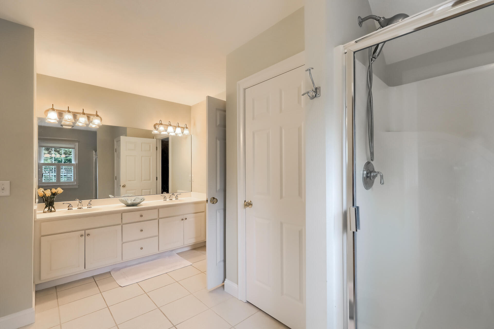 140 Great Marsh Road West Barnstable, MA 02668 - Photo 26 of 46 a bathroom with a double vanity sink mirror and a bathtub