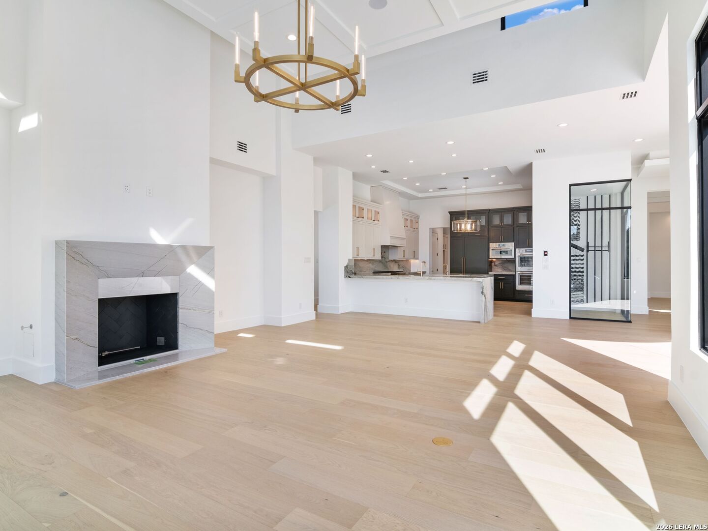 30 Paseo Rioja San Antonio, TX 78257 - Photo 13 of 70 a view of a kitchen with a stove cabinets and a floor to ceiling window
