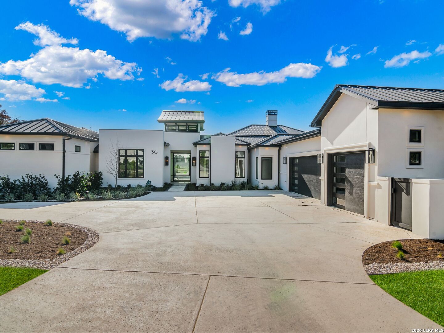 30 Paseo Rioja San Antonio, TX 78257 - Photo 3 of 70 a view of a white house with a yard and potted plants