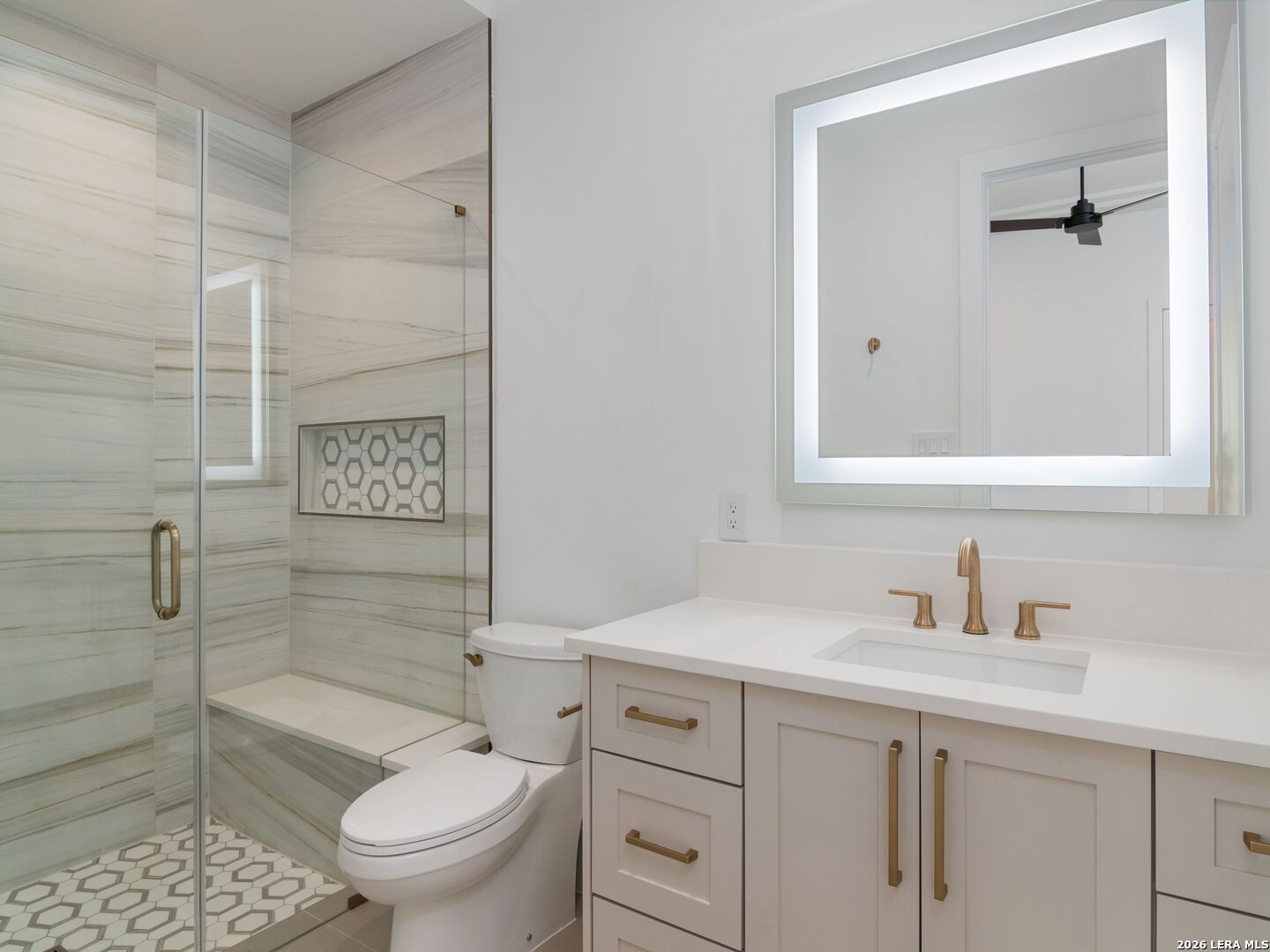 30 Paseo Rioja San Antonio, TX 78257 - Photo 39 of 70 a bathroom with a sink a toilet and shower