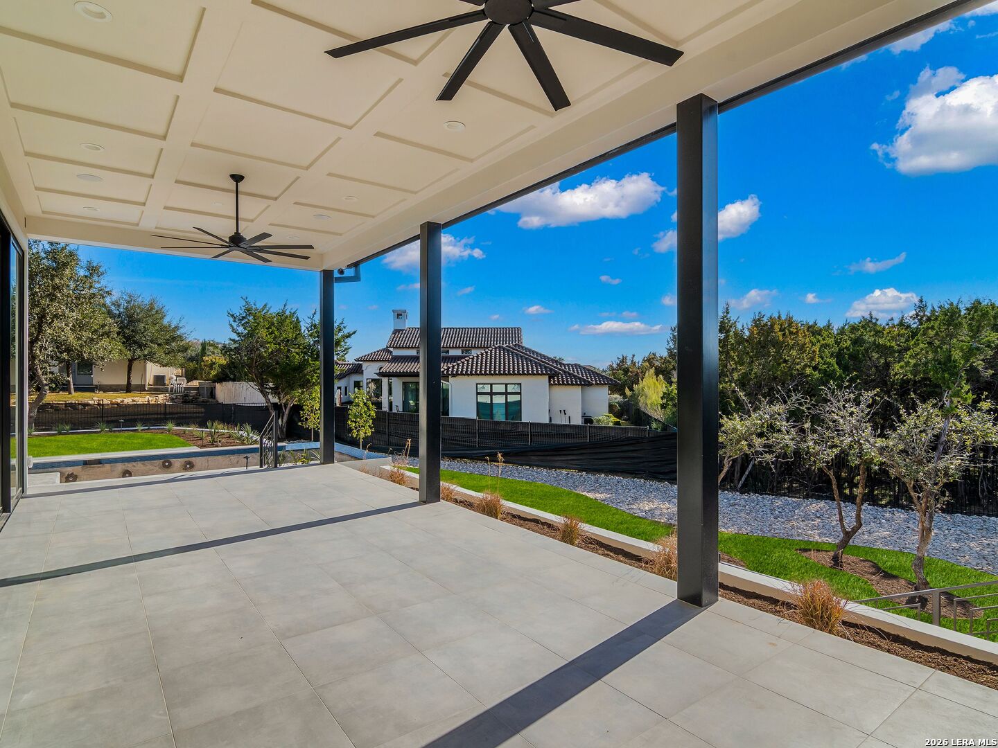 30 Paseo Rioja San Antonio, TX 78257 - Photo 48 of 70 a view of a patio with a table and chairs under an umbrella