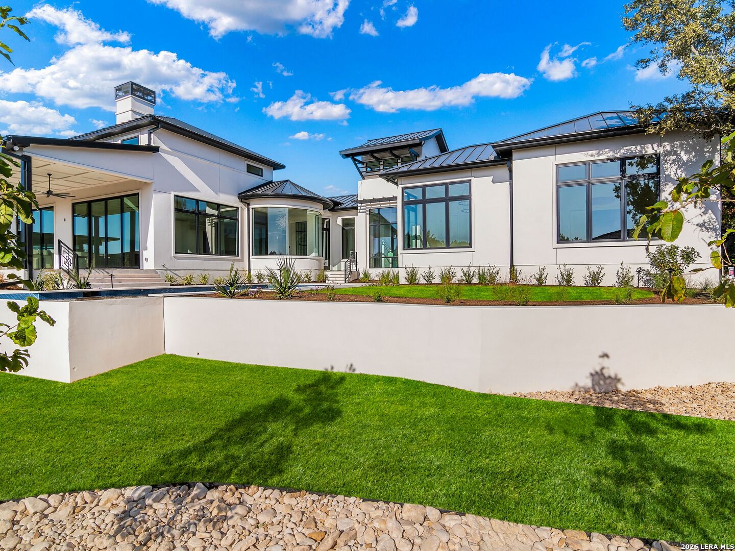 30 Paseo Rioja San Antonio, TX 78257 - Photo 61 of 70 a front view of a house with a yard and potted plants